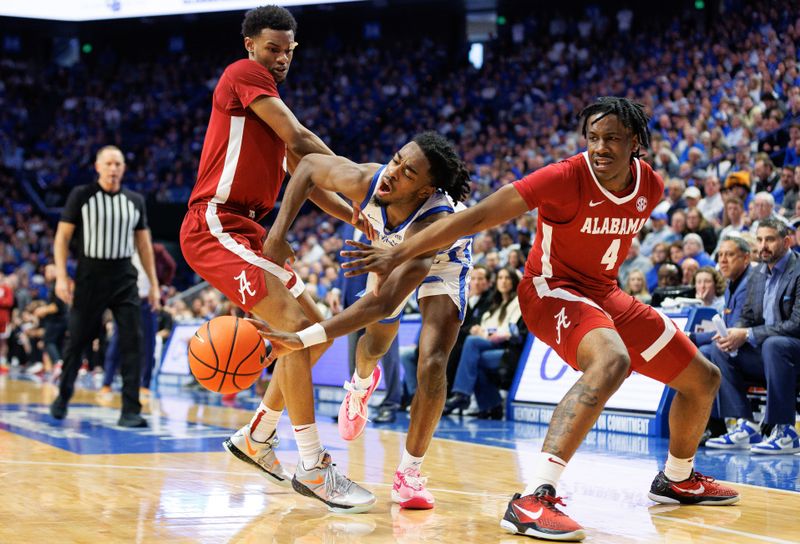 Feb 24, 2024; Lexington, Kentucky, USA; Kentucky Wildcats guard Antonio Reeves (12) drives through Alabama Crimson Tide guard Rylan Griffen (3) and guard Davin Cosby Jr. (4) during the second half at Rupp Arena at Central Bank Center. Mandatory Credit: Jordan Prather-USA TODAY Sports