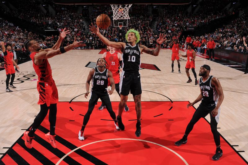 PORTLAND, OR - DECEMBER 13: Jeremy Sochan #10 of the San Antonio Spurs goes up for the rebound during the game against the Portland Trail Blazers on December 13, 2024 at the Moda Center Arena in Portland, Oregon. NOTE TO USER: User expressly acknowledges and agrees that, by downloading and or using this photograph, user is consenting to the terms and conditions of the Getty Images License Agreement. Mandatory Copyright Notice: Copyright 2024 NBAE (Photo by Cameron Browne/NBAE via Getty Images)