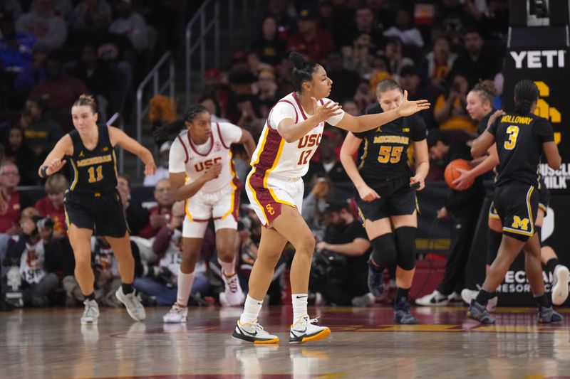 Dec 29, 2024; Los Angeles, California, USA; Southern California Trojans guard JuJu Watkins (12) reacts in the second half against the Michigan Wolverines at the Galen Center. Mandatory Credit: Kirby Lee-Imagn Images