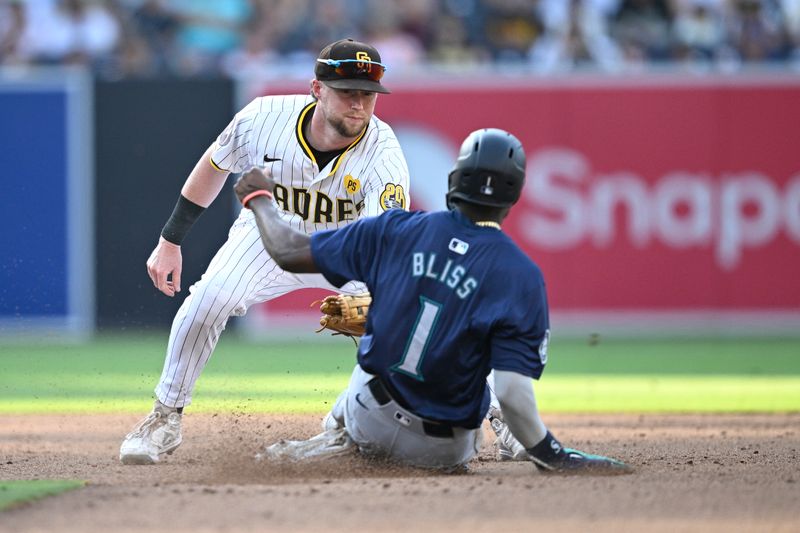 Jul 10, 2024; San Diego, California, USA; Seattle Mariners second baseman Ryan Bliss (1) is tagged out by San Diego Padres second baseman Jake Cronenworth (9) attempting to steal second base during the ninth inning at Petco Park. Mandatory Credit: Orlando Ramirez-USA TODAY Sports