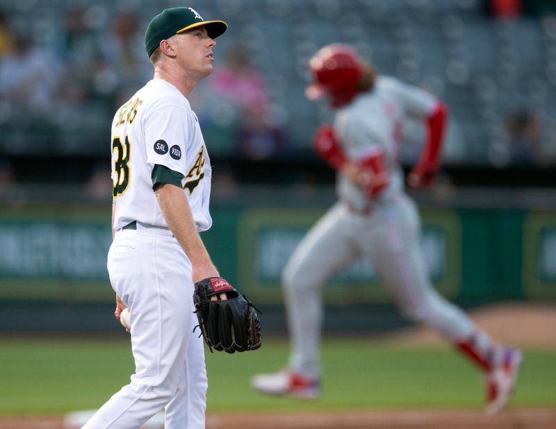 Jun 16, 2023; Oakland, California, USA; Oakland Athletics starting pitcher JP Sears (38) reacts to giving up a two-run home run to Philadelphia Phillies first baseman Alec Bohm (28) during the fourth inning at Oakland-Alameda County Coliseum. Mandatory Credit: D. Ross Cameron-USA TODAY Sports