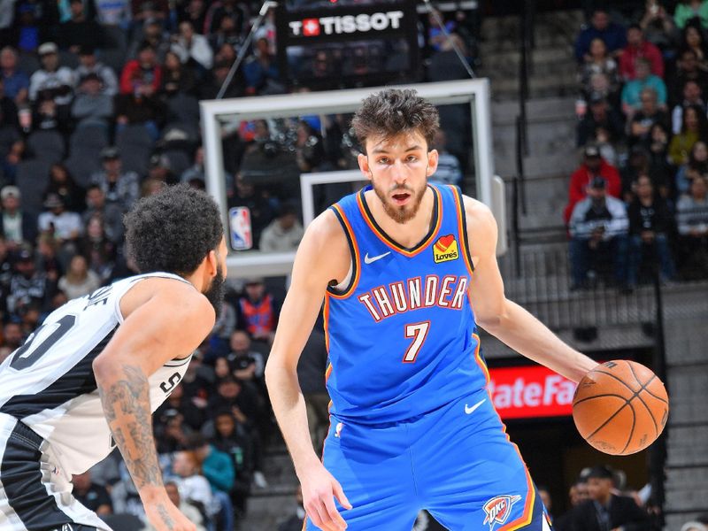 SAN ANTONIO, TX - FEBRUARY 29: Chet Holmgren #7 of the Oklahoma City Thunder dribbles the ball during the game against the San Antonio Spurs on February 29, 2024 at the Frost Bank Center in San Antonio, Texas. NOTE TO USER: User expressly acknowledges and agrees that, by downloading and or using this photograph, user is consenting to the terms and conditions of the Getty Images License Agreement. Mandatory Copyright Notice: Copyright 2024 NBAE (Photos by Michael Gonzales/NBAE via Getty Images)