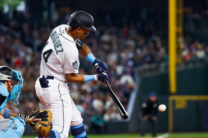 Jun 18, 2023; Seattle, Washington, USA; Seattle Mariners center fielder Julio Rodriguez (44) hits a two-run double against the Chicago White Sox during the third inning at T-Mobile Park. Mandatory Credit: Joe Nicholson-USA TODAY Sports