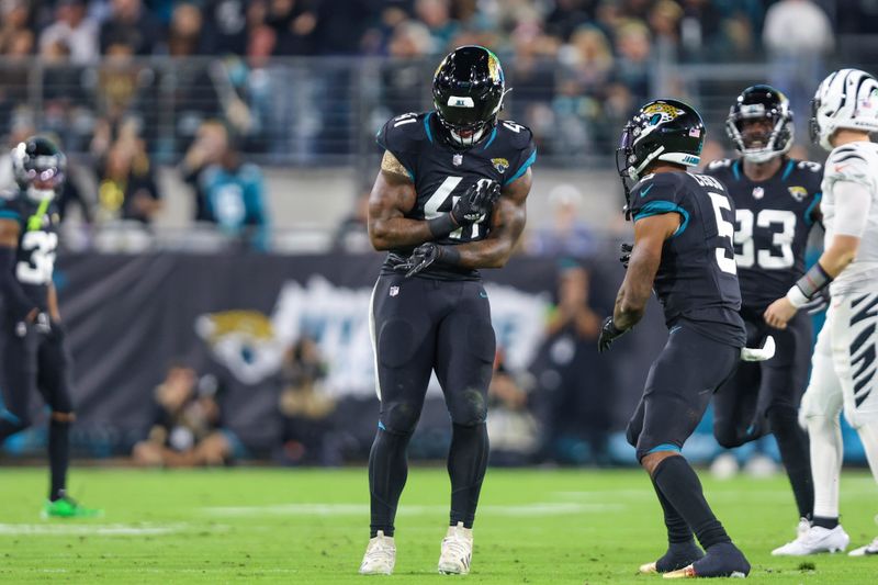 Jacksonville Jaguars linebacker Josh Allen (41) celebrates a play during an NFL football game against the Cincinnati Bengals, Monday, Dec. 4, 2023, in Jacksonville, Fla. (AP Photo/Gary McCullough)