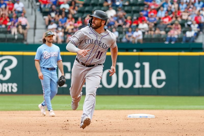 May 21, 2023; Arlington, Texas, USA; Colorado Rockies first baseman Mike Moustakas (11) rounds second base during the eighth inning against the Texas Rangers at Globe Life Field. Mandatory Credit: Andrew Dieb-USA TODAY Sports