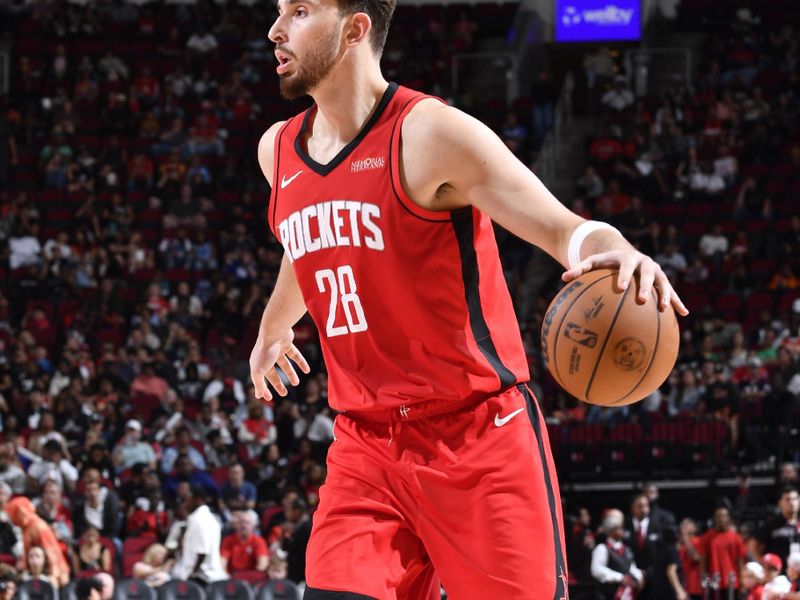 HOUSTON, TX - OCTOBER 25: Alperen Sengun #28 of the Houston Rockets dribbles the ball during the game against the Memphis Grizzlies on October 25, 2024 at the Toyota Center in Houston, Texas. NOTE TO USER: User expressly acknowledges and agrees that, by downloading and or using this photograph, User is consenting to the terms and conditions of the Getty Images License Agreement. Mandatory Copyright Notice: Copyright 2024 NBAE (Photo by Logan Riely/NBAE via Getty Images)