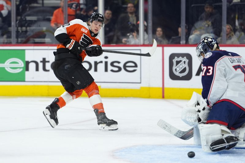 Mar 24, 2026; Philadelphia, Pennsylvania, USA; Philadelphia Flyers left wing Alex Bump (20) shoots the puck against Columbus Blue Jackets goalie Jet Greaves (73) in the third period at Xfinity Mobile Arena. Mandatory Credit: Kyle Ross-Imagn Images