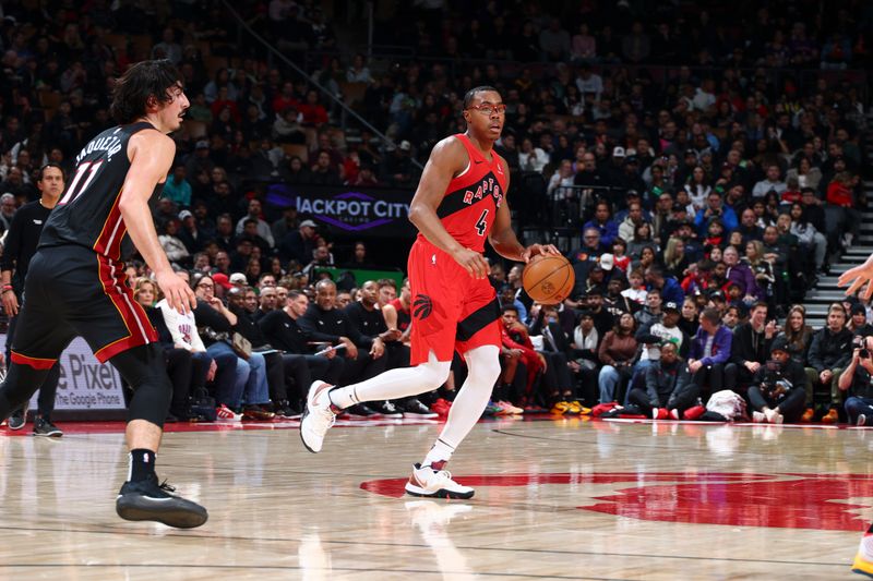 TORONTO, CANADA - DECEMBER 01:  Scottie Barnes #4 of the Toronto Raptors dribbles the ball during the game against the Miami Heat on December 1, 2024 at the Scotiabank Arena in Toronto, Ontario, Canada.  NOTE TO USER: User expressly acknowledges and agrees that, by downloading and or using this Photograph, user is consenting to the terms and conditions of the Getty Images License Agreement.  Mandatory Copyright Notice: Copyright 2024 NBAE (Photo by Vaughn Ridley/NBAE via Getty Images)