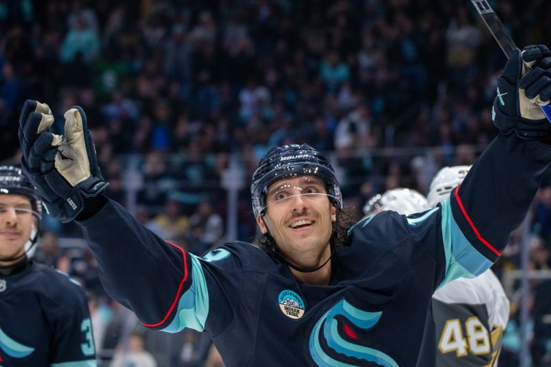 Nov 8, 2024; Seattle, Washington, USA;  Seattle Kraken forward Brandon Tanev (13) celebrates after scoring a goal during the second period against the Vegas Golden Knights at Climate Pledge Arena. Mandatory Credit: Stephen Brashear-Imagn Images