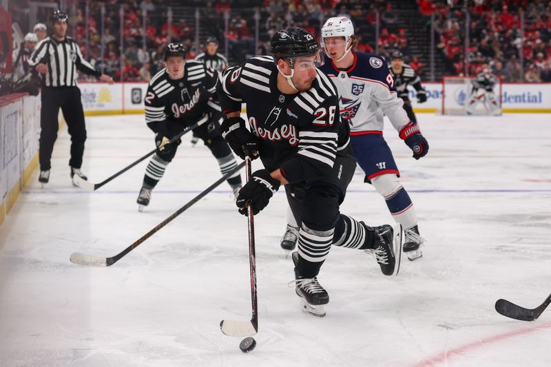Feb 3, 2026; Newark, New Jersey, USA; New Jersey Devils right wing Timo Meier (28) skates with the puck against the Columbus Blue Jackets during the second period at Prudential Center. Mandatory Credit: Ed Mulholland-Imagn Images