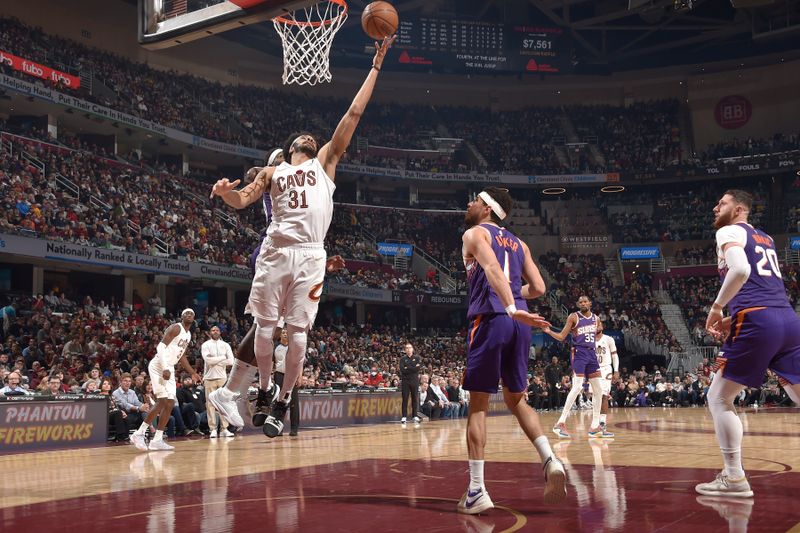 CLEVELAND, OH - MARCH 11:  Jarrett Allen #31 of the Cleveland Cavaliers drives to the basket during the game against the Phoenix Suns on March 11, 2024 at Rocket Mortgage FieldHouse in Cleveland, Ohio. NOTE TO USER: User expressly acknowledges and agrees that, by downloading and/or using this Photograph, user is consenting to the terms and conditions of the Getty Images License Agreement. Mandatory Copyright Notice: Copyright 2024 NBAE (Photo by David Liam Kyle/NBAE via Getty Images)