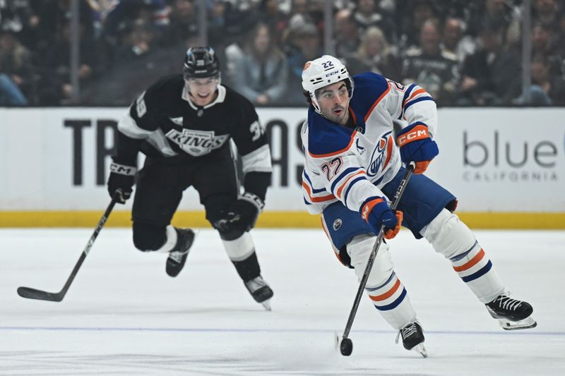 Feb 26, 2026; Los Angeles, California, USA; Edmonton Oilers center Matt Savoie (22) advances the puck down ice against the Los Angeles Kings during the first period at Crypto.com Arena. Mandatory Credit: Griffin Hooper-Imagn Images  