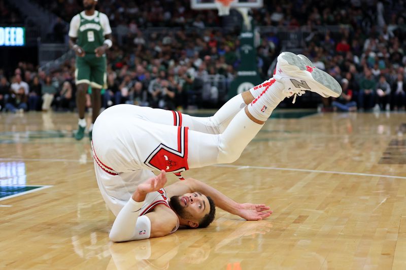 MILWAUKEE, WISCONSIN - OCTOBER 25: Zach LaVine #8 of the Chicago Bulls is fouled by Damian Lillard #0 of the Milwaukee Bucks during the first half of a game at Fiserv Forum on October 25, 2024 in Milwaukee, Wisconsin. NOTE TO USER: User expressly acknowledges and agrees that, by downloading and or using this photograph, User is consenting to the terms and conditions of the Getty Images License Agreement. (Photo by Stacy Revere/Getty Images)