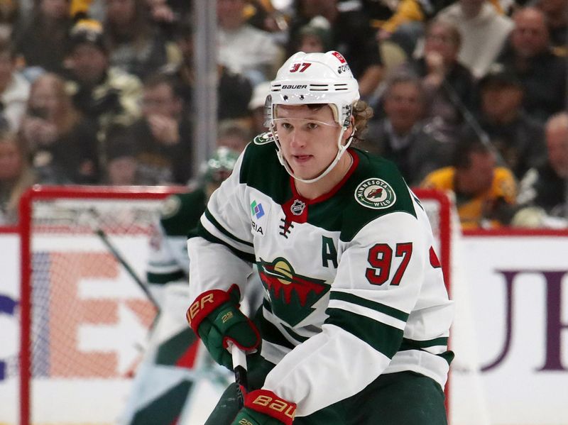 Oct 29, 2024; Pittsburgh, Pennsylvania, USA; Minnesota Wild left wing Kirill Kaprizov (97) skates up ice with the puck against the Pittsburgh Penguins during the second period at PPG Paints Arena. Mandatory Credit: Charles LeClaire-Imagn Images