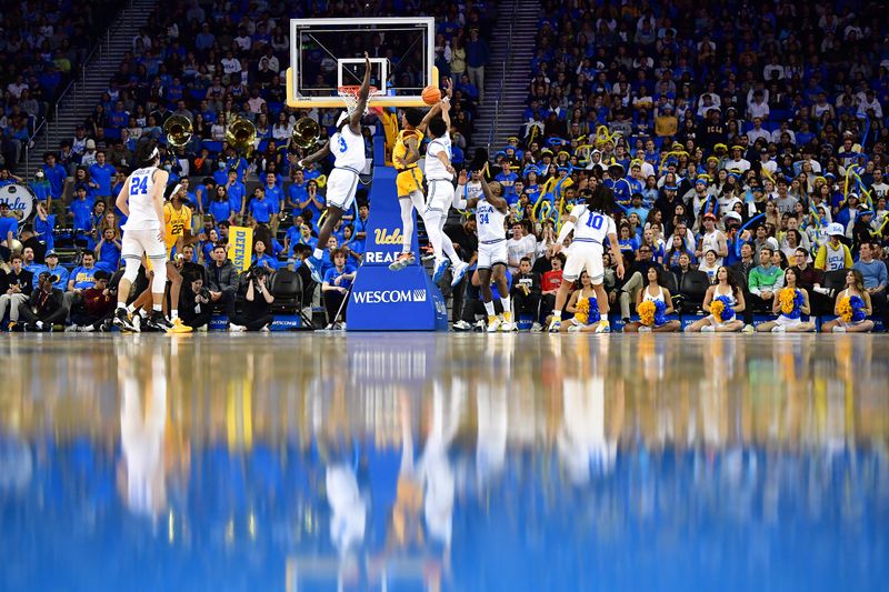 Mar 2, 2023; Los Angeles, California, USA; UCLA Bruins forward Adem Bona (3) and guard Jaylen Clark (0) defend a shot against Arizona State Sun Devils guard Desmond Cambridge Jr. (4) during the second half at Pauley Pavilion. Mandatory Credit: Gary A. Vasquez-USA TODAY Sports