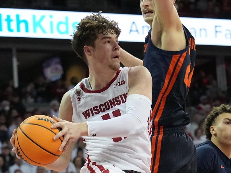 Jan 1, 2023; Madison, Wis, USA; Wisconsin guard Max Klesmit (11) finds an open teammate while being guarded by Illinois forward Matthew Mayer (24) during the second half of their game at the Kohl Center. Mandatory Credit: Mark Hoffman/Milwaukee Journal Sentinel via USA TODAY NETWORK