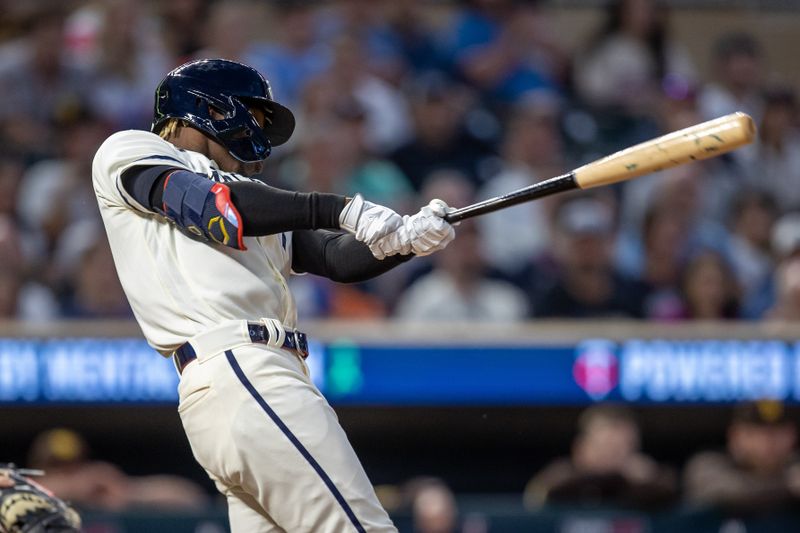 May 10, 2023; Minneapolis, Minnesota, USA; Minnesota Twins second baseman Nick Gordon (1) hits a single in the eighth inning against the San Diego Padres at Target Field. Mandatory Credit: Jesse Johnson-USA TODAY Sports