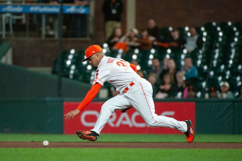 Sep 12, 2023; San Francisco, California, USA; San Francisco Giants first baseman LaMonte Wade Jr. (31) reaches for the ball during the fifth inning against the Cleveland Guardians at Oracle Park. Mandatory Credit: Ed Szczepanski-USA TODAY Sports