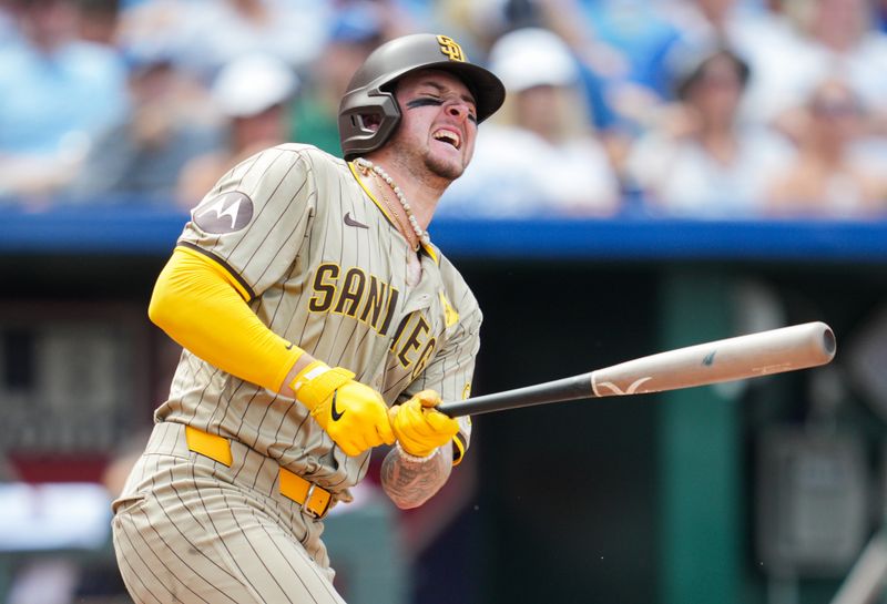 Jun 1, 2024; Kansas City, Missouri, USA; San Diego Padres center fielder Jackson Merrill (3) reacts after fouling a ball off his foot during the fourth inning against the Kansas City Royals at Kauffman Stadium. Mandatory Credit: Jay Biggerstaff-USA TODAY Sports