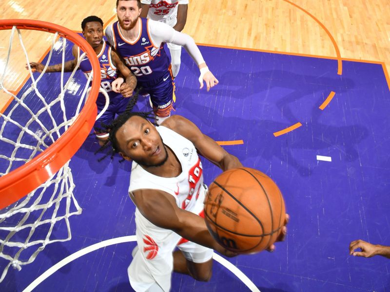 PHOENIX, AZ - MARCH 7: Immanuel Quickley #5 of the Toronto Raptors drives to the basket during the game against the Phoenix Suns on March 7, 2024 at Footprint Center in Phoenix, Arizona. NOTE TO USER: User expressly acknowledges and agrees that, by downloading and or using this photograph, user is consenting to the terms and conditions of the Getty Images License Agreement. Mandatory Copyright Notice: Copyright 2024 NBAE (Photo by Barry Gossage/NBAE via Getty Images)