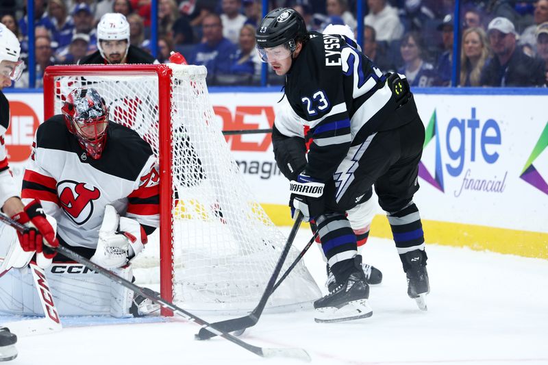 Nov 16, 2024; Tampa, Florida, USA; Tampa Bay Lightning center Michael Eyssimont (23) controls the puck against the New Jersey Devils in the third period at Amalie Arena. Mandatory Credit: Nathan Ray Seebeck-Imagn Images