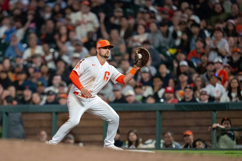 Aug 29, 2023; San Francisco, California, USA;  San Francisco Giants first baseman J.D. Davis (7) forces out Cincinnati Reds first baseman Christian Encarnacion-Strand (not pictured) during the eighth inning at Oracle Park. Mandatory Credit: Neville E. Guard-USA TODAY Sports