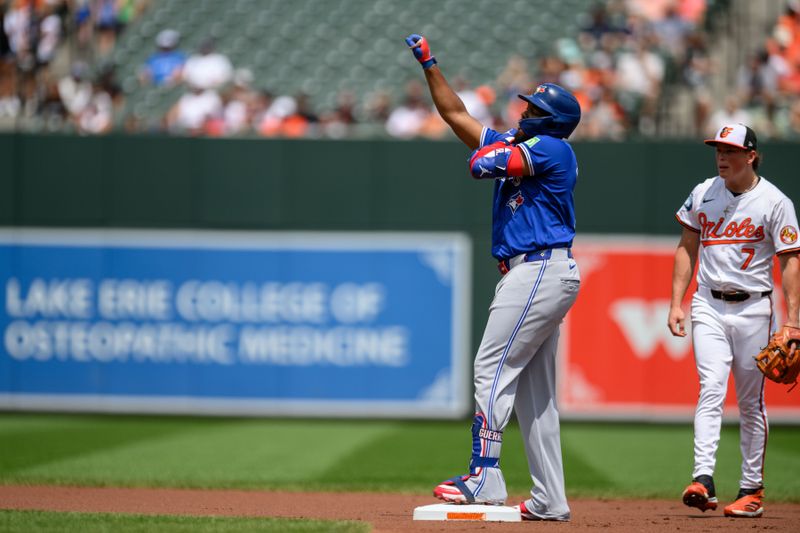 Jul 31, 2024; Baltimore, Maryland, USA; Toronto Blue Jays first baseman Vladimir Guerrero Jr. (27) reacts after hitting a double against the Baltimore Orioles during the first inning at Oriole Park at Camden Yards. Mandatory Credit: Reggie Hildred-USA TODAY Sports