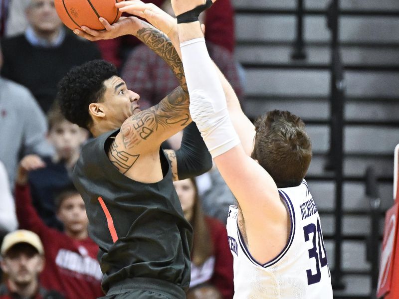 Feb 18, 2024; Bloomington, Indiana, USA;  Northwestern Wildcats center Matthew Nicholson (34) blocks a shot attempt from Indiana Hoosiers center Kel'el Ware (1) during the second half at Simon Skjodt Assembly Hall. Mandatory Credit: Robert Goddin-USA TODAY Sports