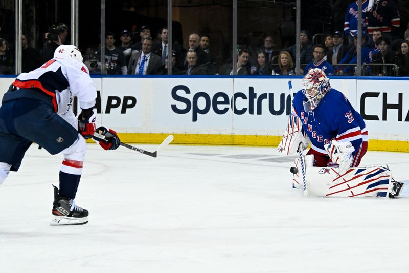 Apr 23, 2024; New York, New York, USA;  New York Rangers goaltender Igor Shesterkin (31) makes a save on Washington Capitals defenseman Martin Fehervary (42) during the second period in game two of the first round of the 2024 Stanley Cup Playoffs at Madison Square Garden. Mandatory Credit: Dennis Schneidler-USA TODAY Sports