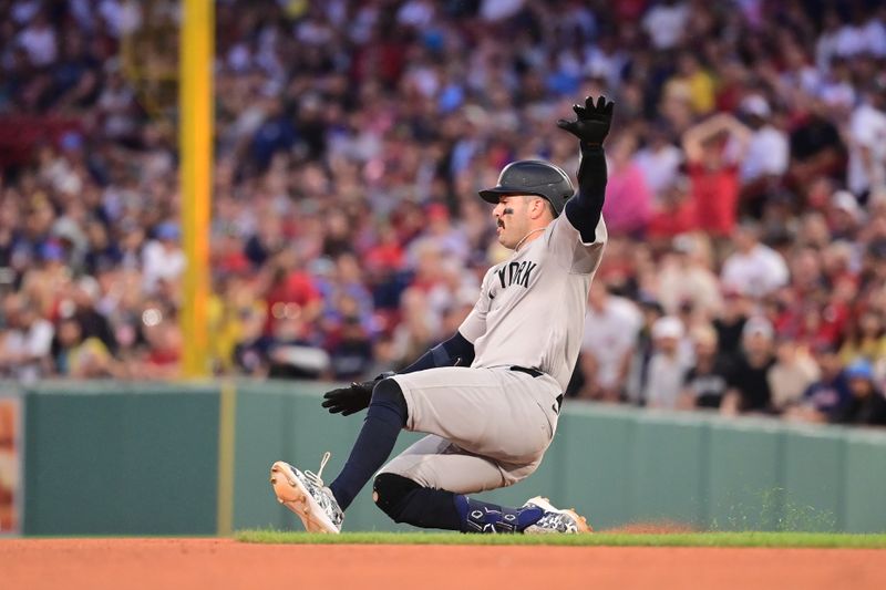 Jul 28, 2024; Boston, Massachusetts, USA; New York Yankees catcher Austin Wells (28) slides into second base during the fourth inning against the Boston Red Sox at Fenway Park. Mandatory Credit: Eric Canha-USA TODAY Sports