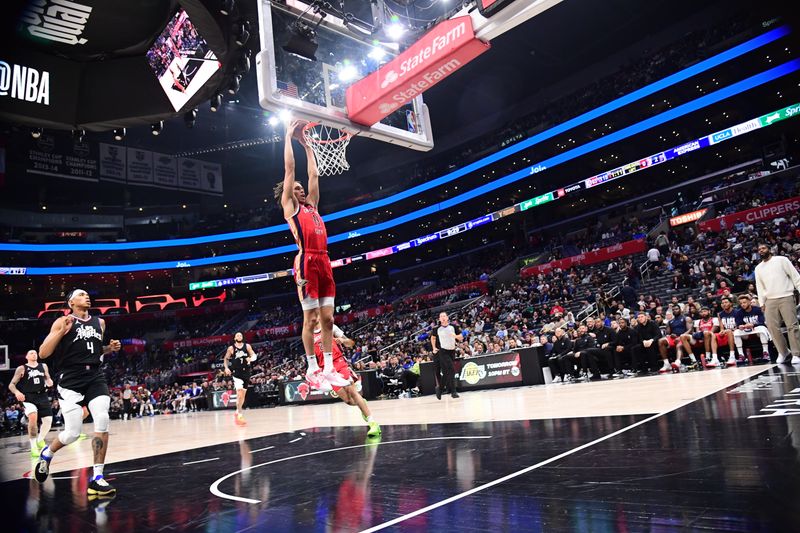 LOS ANGELES, CA - FEBRUARY 7: Dyson Daniels #11 of the New Orleans Pelicans dunks the ball during the game against the LA Clippers on February 7, 2024 at Crypto.Com Arena in Los Angeles, California. NOTE TO USER: User expressly acknowledges and agrees that, by downloading and/or using this Photograph, user is consenting to the terms and conditions of the Getty Images License Agreement. Mandatory Copyright Notice: Copyright 2024 NBAE (Photo by Adam Pantozzi/NBAE via Getty Images)