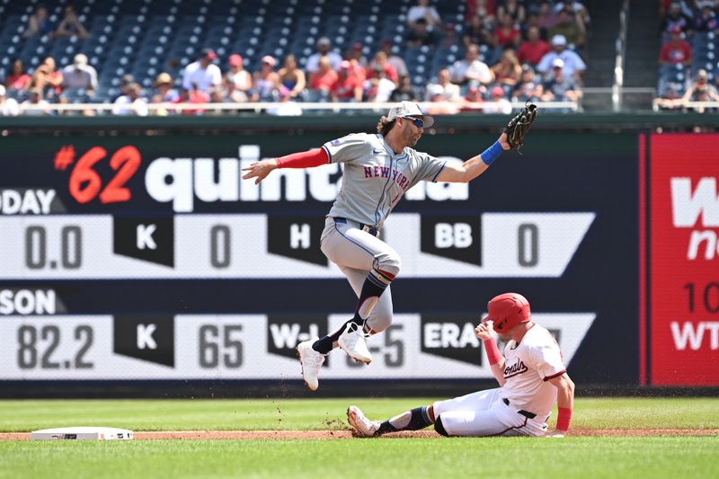 Jul 4, 2024; Washington, District of Columbia, USA; Washington Nationals right fielder Lane Thomas (28) steals second base in front of New York Mets second baseman Jeff McNeil (1) at Nationals Park. Mandatory Credit: Rafael Suanes-USA TODAY Sports