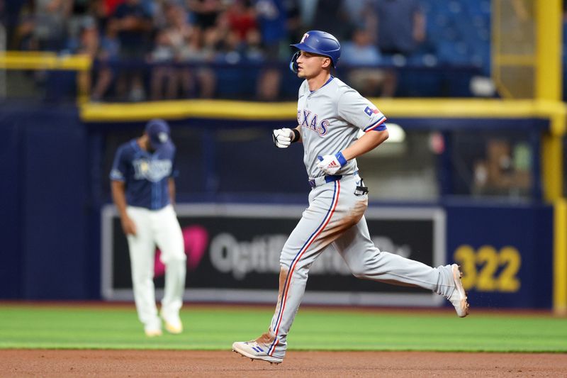 Apr 3, 2024; St. Petersburg, Florida, USA;  Texas Rangers designated hitter Corey Seager (5) runs the bases after hitting a solo home run against the Tampa Bay Rays in the sixth inning at Tropicana Field. Mandatory Credit: Nathan Ray Seebeck-USA TODAY Sports