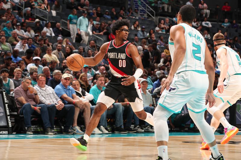 CHARLOTTE, NC - APRIL 3: Scoot Henderson #00 of the Portland Trail Blazers handles the ball during the game  on April 3, 2024 at Spectrum Center in Charlotte, North Carolina. NOTE TO USER: User expressly acknowledges and agrees that, by downloading and or using this photograph, User is consenting to the terms and conditions of the Getty Images License Agreement. Mandatory Copyright Notice: Copyright 2024 NBAE (Photo by Kent Smith/NBAE via Getty Images)