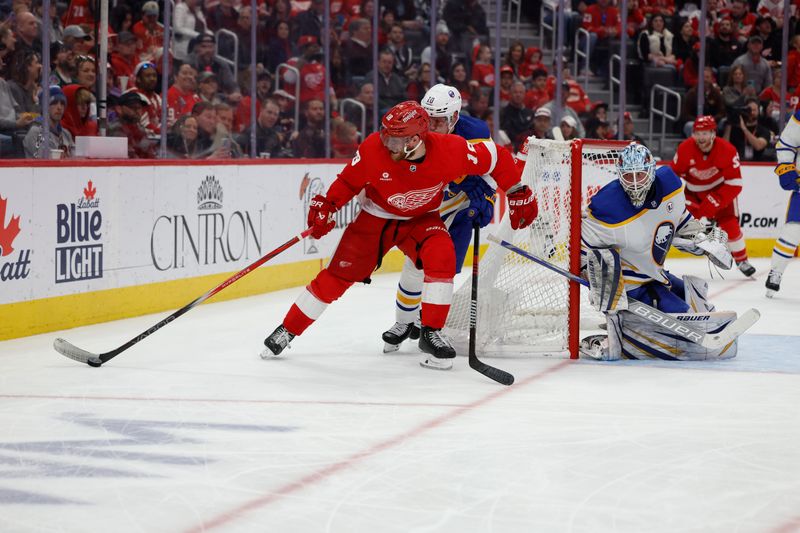 Apr 7, 2024; Detroit, Michigan, USA; Detroit Red Wings center Andrew Copp (18) skates with the puck chased by Buffalo Sabres defenseman Henri Jokiharju (10) in the second period at Little Caesars Arena. Mandatory Credit: Rick Osentoski-USA TODAY Sports