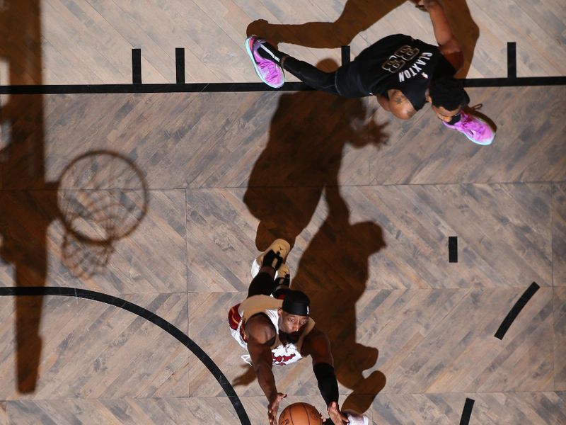 BROOKLYN, NY - JANUARY 15: Caleb Martin #16 of the Miami Heat grabs a rebound during the game against the Brooklyn Nets on January 15, 2024 at Barclays Center in Brooklyn, New York. NOTE TO USER: User expressly acknowledges and agrees that, by downloading and or using this Photograph, user is consenting to the terms and conditions of the Getty Images License Agreement. Mandatory Copyright Notice: Copyright 2024 NBAE (Photo by Nathaniel S. Butler/NBAE via Getty Images)