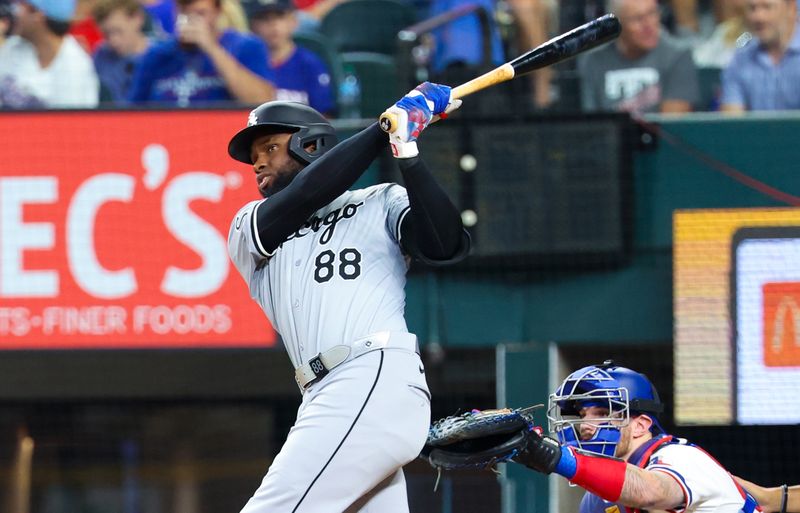 Jul 24, 2024; Arlington, Texas, USA; Chicago White Sox center fielder Luis Robert Jr. (88) hits a home run during the third inning against the Texas Rangers at Globe Life Field. Mandatory Credit: Kevin Jairaj-USA TODAY Sports