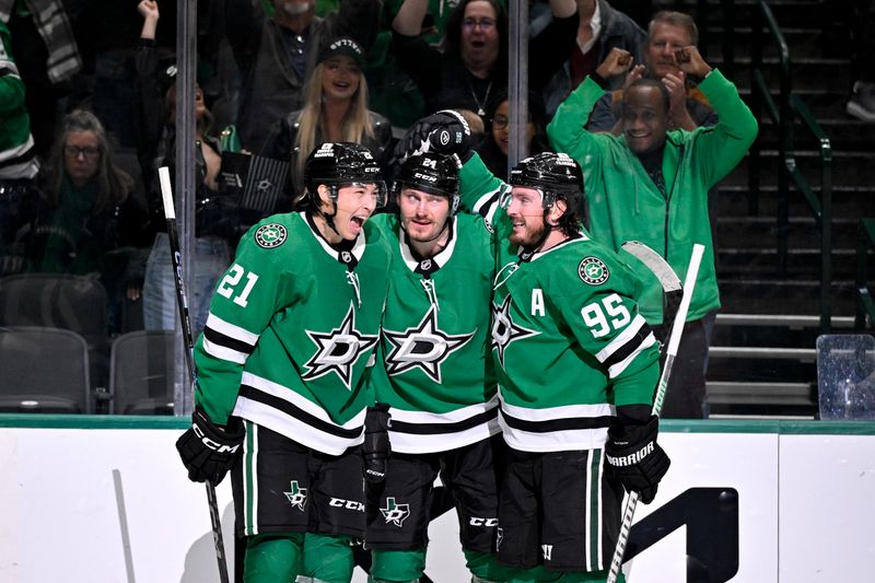 Mar 6, 2025; Dallas, Texas, USA; Dallas Stars left wing Jason Robertson (21) and center Matt Duchene (95) and center Roope Hintz (24) celebrates after Robertson scores the game winning goal the Calgary Flames during the overtime period at the American Airlines Center. Mandatory Credit: Jerome Miron-Imagn Images