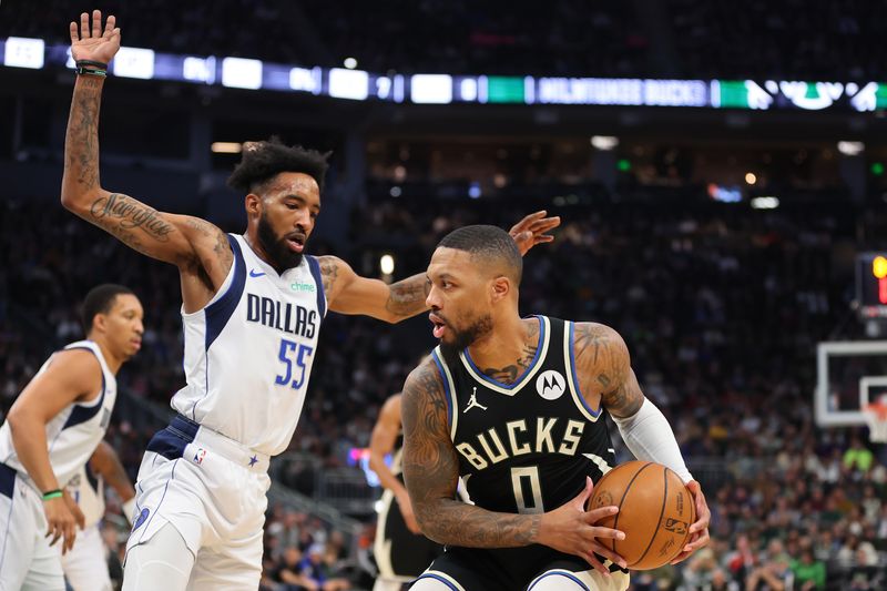 MILWAUKEE, WISCONSIN - NOVEMBER 18: Damian Lillard #0 of the Milwaukee Bucks is defended by Derrick Jones Jr. #55 of the Dallas Mavericks during the second half of a game at Fiserv Forum on November 18, 2023 in Milwaukee, Wisconsin. NOTE TO USER: User expressly acknowledges and agrees that, by downloading and or using this photograph, User is consenting to the terms and conditions of the Getty Images License Agreement. (Photo by Stacy Revere/Getty Images)