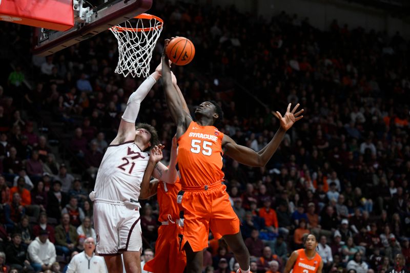 Jan 28, 2023; Blacksburg, Virginia, USA;  Syracuse Orange center Mounir Hima (55) controls rebound over Virginia Tech Hokies forward Grant Basile (21) in the second half at Cassell Coliseum. Mandatory Credit: Lee Luther Jr.-USA TODAY Sports