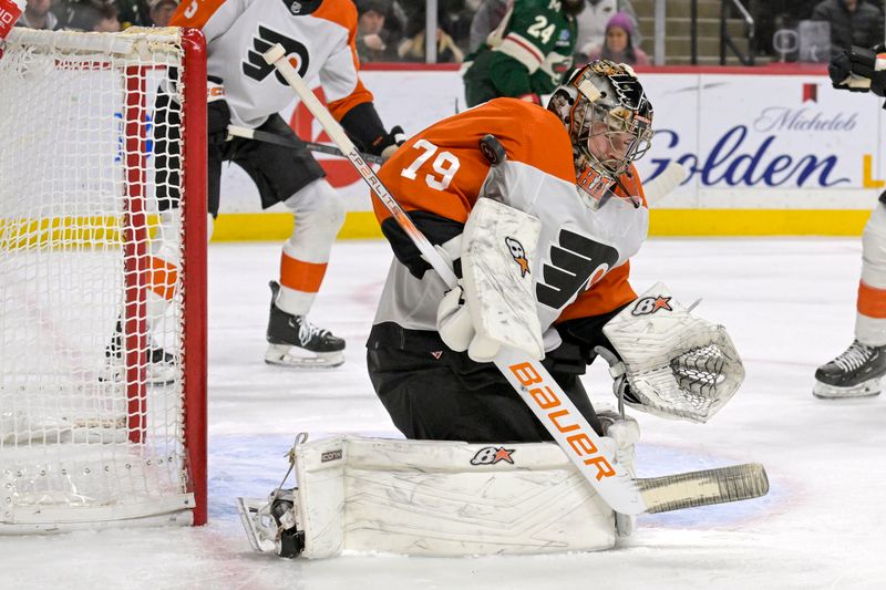 Jan 12, 2024; Saint Paul, Minnesota, USA; Philadelphia Flyers goalie Carter Hart (79) makes a save against the Minnesota Wild during the second period at Xcel Energy Center. Mandatory Credit: Nick Wosika-USA TODAY Sports