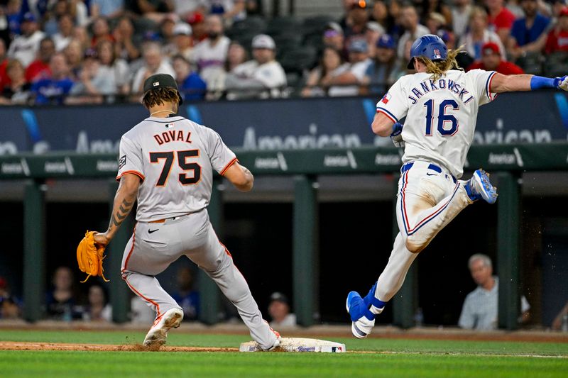 Jun 8, 2024; Arlington, Texas, USA; San Francisco Giants relief pitcher Camilo Doval (75) puts out Texas Rangers left fielder Travis Jankowski (16) at first base during the ninth inning at Globe Life Field. Mandatory Credit: Jerome Miron-USA TODAY Sports