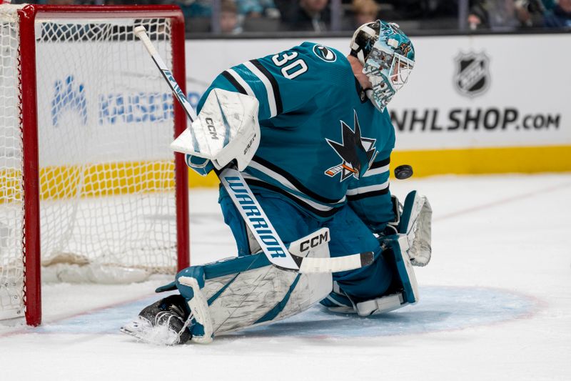 Dec 28, 2023; San Jose, California, USA; San Jose Sharks goalie Magnus Chrona (30) cannot stop the shot on goal Edmonton Oilers left wing Zach Hyman (not pictured) during the first period at SAP Center at San Jose. Mandatory Credit: Neville E. Guard-USA TODAY Sports