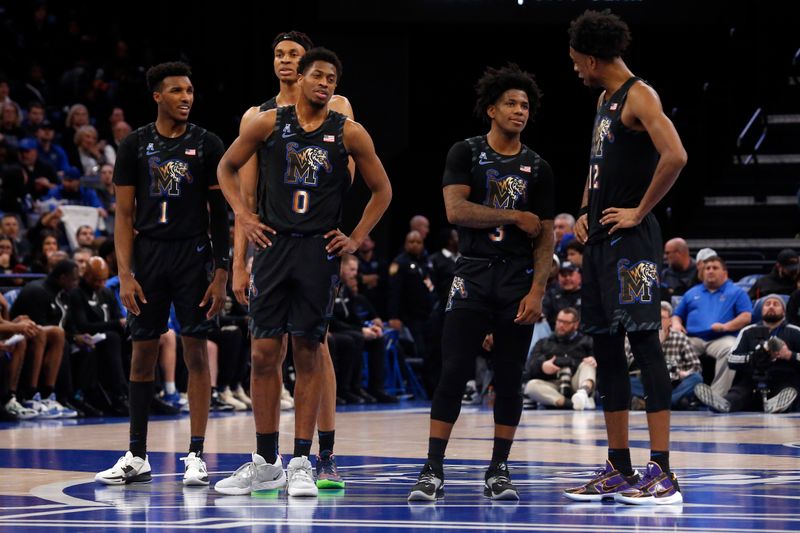 Jan 26, 2023; Memphis, Tennessee, USA; Memphis Tigers guard Keonte Kennedy (1), forward Kaodirichi Akobundu-Ehiogu (5), guard Elijah McCadden (0), guard Kendric Davis (3) and forward DeAndre Williams (12) wait for play to resume during the second half against the Southern Methodist Mustangs at FedExForum. Mandatory Credit: Petre Thomas-USA TODAY Sports