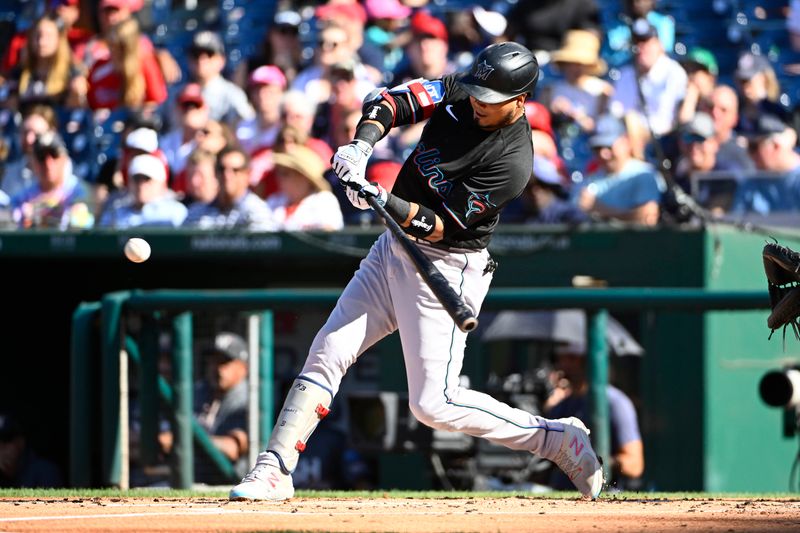 Sep 2, 2023; Washington, District of Columbia, USA; Miami Marlins second baseman Luis Arraez (3) hits a RBI single against the Washington Nationals during the second inning at Nationals Park. Mandatory Credit: Brad Mills-USA TODAY Sports