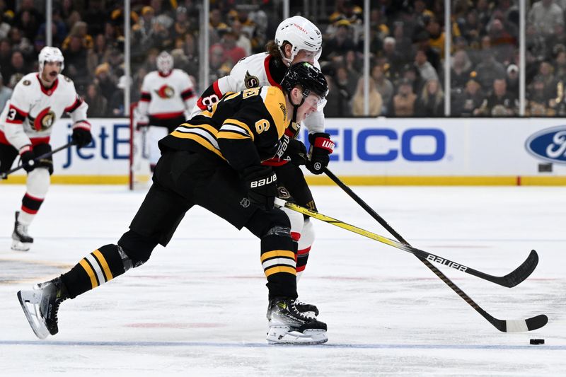 Nov 9, 2024; Boston, Massachusetts, USA; Ottawa Senators right wing Adam Gaudette (81) and Boston Bruins defenseman Mason Lohrei (6) battle for the puck during the second period at TD Garden. Mandatory Credit: Brian Fluharty-Imagn Images