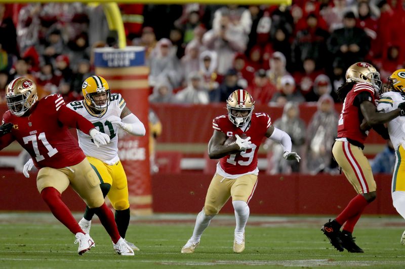 San Francisco 49ers wide receiver Deebo Samuel (19) runs during an NFL divisional round playoff football game against the Green Bay Packers Saturday, Jan. 20, 2024, in Santa Clara. (AP Photo/Scot Tucker)