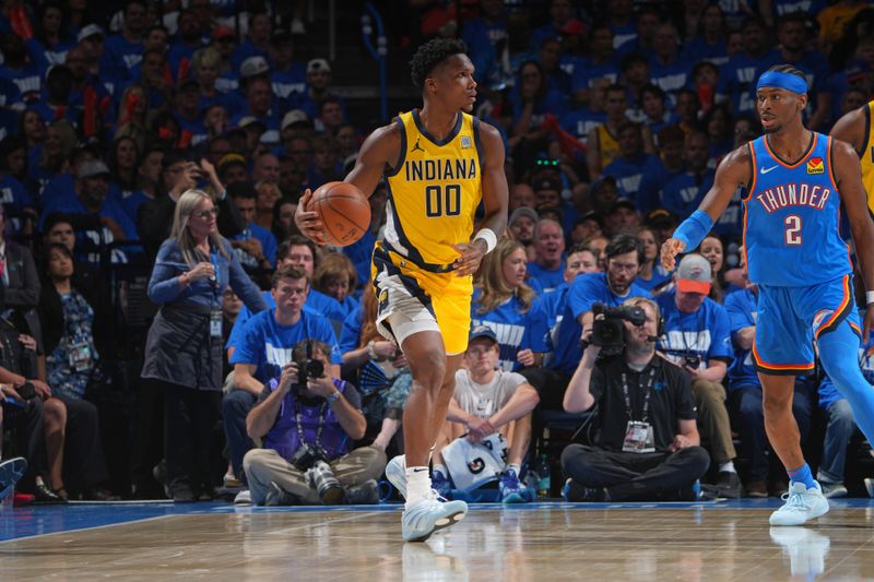 OKLAHOMA CITY, OK - JUNE 8:  Bennedict Mathurin #00 of the Indiana Pacers dribbles the ball during the game against the Oklahoma City Thunder during Game Two of the 2025 NBA Finals on June 8, 2025 at Paycom Center in Oklahoma City, Oklahoma. NOTE TO USER: User expressly acknowledges and agrees that, by downloading and or using this photograph, User is consenting to the terms and conditions of the Getty Images License Agreement. Mandatory Copyright Notice: Copyright 2025 NBAE (Photo by Jesse D. Garrabrant/NBAE via Getty Images)