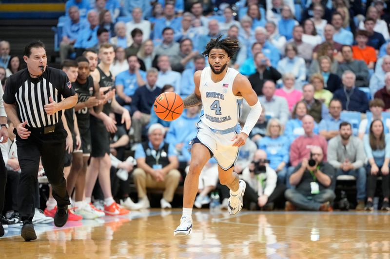 Feb 17, 2024; Chapel Hill, North Carolina, USA; North Carolina Tar Heels guard RJ Davis (4) dribbles in the second half at Dean E. Smith Center. Mandatory Credit: Bob Donnan-USA TODAY Sports
