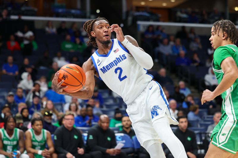Dec 31, 2025; Memphis, Tennessee, USA; Memphis Tigers guard Zach Davis (2) saves a loose ball against the North Texas Mean Green during the first half at FedExForum. Mandatory Credit: Wesley Hale-Imagn Images